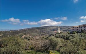 a view of a hill with a building and a clock tower at Villa Marisa in Perdifumo