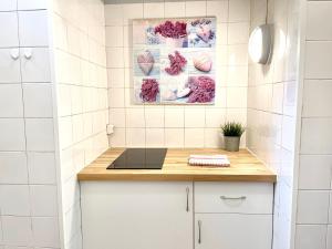 a small kitchen with white tiled walls and a counter at Apartments Center Castelo de São Jorge I in Lisbon