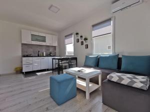 a living room with a couch and a table at Kucerak111 in Vrdnik