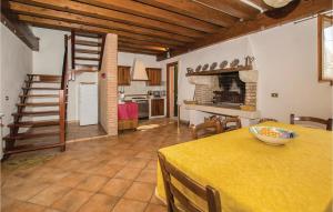 a kitchen and dining room with a table with a bowl on it at Carustica in Ca Lino