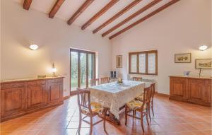 a large dining room with a table and chairs at Villa Il Casale in Sperlonga +16 photos