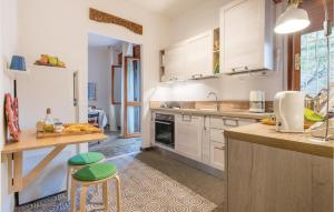 A kitchen or kitchenette at 2 Bedroom Lovely Apartment In Rimini