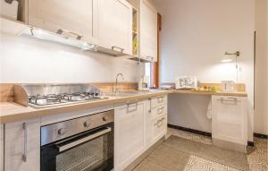 A kitchen or kitchenette at 2 Bedroom Lovely Apartment In Rimini