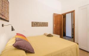 A bed or beds in a room at 2 Bedroom Lovely Apartment In Rimini