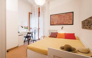 A bed or beds in a room at 2 Bedroom Lovely Apartment In Rimini