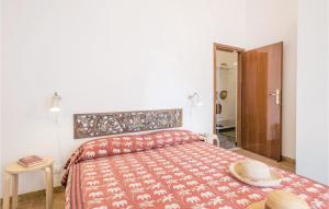 A bed or beds in a room at 2 Bedroom Lovely Apartment In Rimini