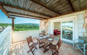 a patio with a table and chairs on a balcony at Trilo 6 Vm in Baja Sardinia