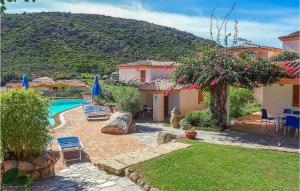 a house with a swimming pool in a yard at Trilo 6 in Budoni