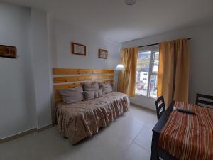 A bed or beds in a room at Las Lajas