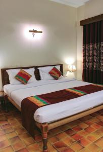 Postel nebo postele na pokoji v ubytování Palace On Ganges - Heritage Hotel + 34 fotografií