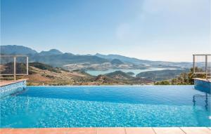 a swimming pool with a view of the water at Gorgeous Home In Cádiz With Wifi in El Gastor