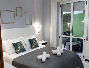 Un pat sau paturi într-o cameră la Hotel Mizar