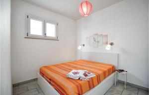 Posteľ alebo postele v izbe v ubytovaní Cozy Home In San Vito Lo Capo -Tp-