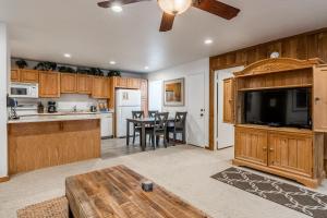 a kitchen with wooden cabinets and a dining room at Hidden Valley Village #103 nicely updated 1 bedroom 1 bathroom condo short 10 min walk from Village in Mammoth Lakes