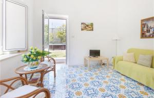 a living room with a couch and a table at Villa La Limonaia in Sorrento