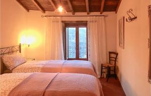 A bed or beds in a room at Casa Maria Pieve