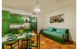 a living room with a couch and a table at Lovely Apartment In Orosei With Wifi in Orosei