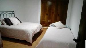 Łóżko lub łóżka w pokoju w obiekcie CASA MI SUEÑO