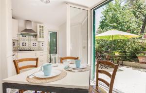 a kitchen and dining room with a table and chairs at Villa Dellolivo in Sorrento