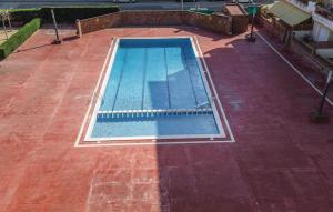 an overhead view of a swimming pool on a patio at Nice Apartment In Blanes With Kitchen in Blanes