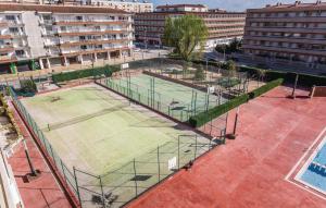 an aerial view of two tennis courts in a city at Nice Apartment In Blanes With Kitchen in Blanes +14 photos
