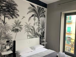 Łóżko lub łóżka w pokoju w obiekcie Parthenope Rooms