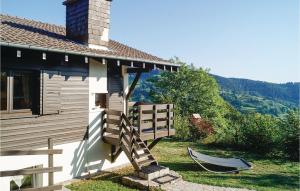 a house with a porch with a hammock next to it at Awesome Home In Basse-Sur-Le-Rupt in Basse-sur-le-Rupt +18 photos