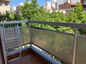 a balcony with a cage on it with trees at Monoambiente con cochera. Excelente ubicación. in Mar del Plata