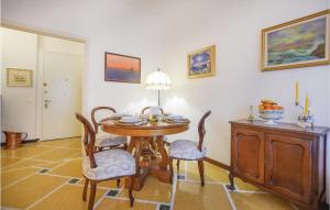 a dining room with a wooden table and chairs at Casa Donatella in Rapallo