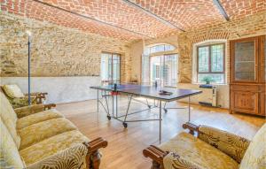 a living room with a ping pong table in it at Casa I Fiordalisi in Aramengo