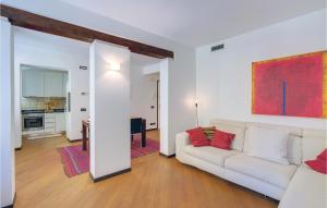 a living room with a white couch and a kitchen at Stunning Apartment In Venezia -Ve- in Venice