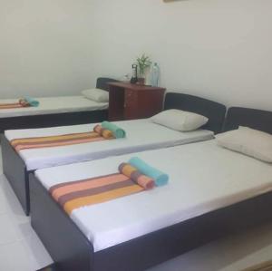 Letto o letti in una camera di Dinimuthu Rest Inn