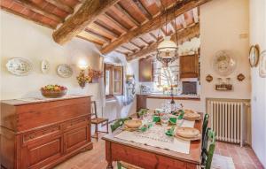 a kitchen with a table and a dining room at Casa Al Vento in Battifolle