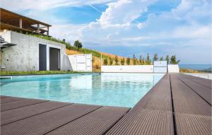 a swimming pool in a villa with a view at Villetta Il Mirto in Belladonna
