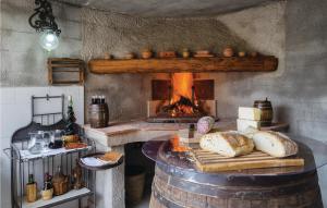 a kitchen with a oven with bread on a table at Casa Rosa in Terranuova Bracciolini