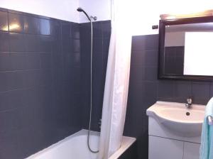 a bathroom with a shower, sink, and toilet at Holidays Madeira in São Vicente