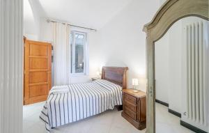a bedroom with a bed and a dresser and a mirror at Alloro in Rapallo