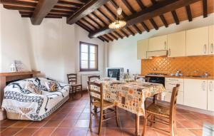 a kitchen and dining room with a table and chairs at Beautiful Home In Casalguidi Pt in Cantagrillo +10 photos