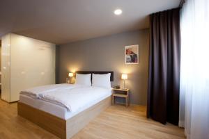 Postel nebo postele na pokoji v ubytování Hotel am Garnmarkt + 32 fotografií