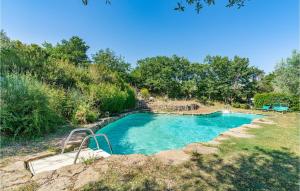 a swimming pool in the middle of a yard at 2 Bedroom Nice Apartment In Ambra Ar in Badia a Ruoti