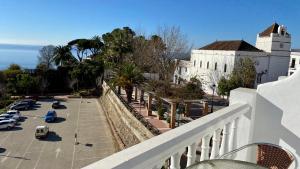a view from a balcony of a building and a parking lot at Apartamentos Balcón de Maro in Maro
