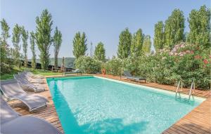 a swimming pool with chaise lounge chairs and a swimming pool at Casale Orsini in Magliano Sabina