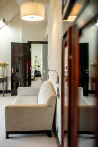 a living room with a couch in a room at Astoria Hotel in Lviv