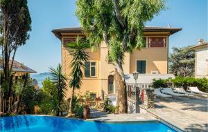 a house with a swimming pool in front of a house at Il Veliero in Rapallo