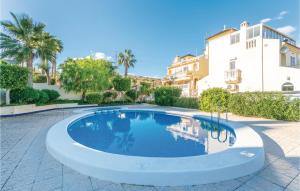 a swimming pool in a courtyard with a house at Urb, Pueblo Lucero in Rojales