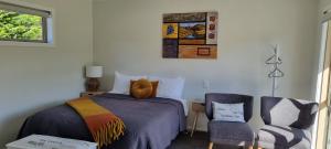 A bed or beds in a room at Lodges On Pearson Unit 1