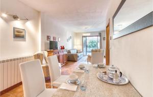 a dining room and living room with a table and chairs at Stella Marina in Puntone di Scarlino +9 photos
