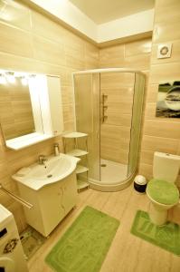 Ванная комната в Summerland Sea View Exclusive Apartment - Mamaia