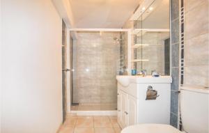 a bathroom with a shower and a sink at Cozy Apartment In Vinassan With Wifi in Vinassan +12 photos