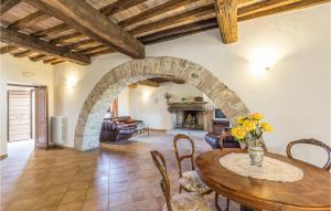 a living room with a table and a fireplace at Portella in Saragano